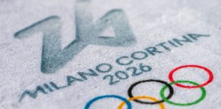 Samsung VP says Olympic sponsorship must reflect how fans follow athletes, not events MILAN, ITALY, OCTOBER 20, 2025: Logo of Winter Olympics Game 2026 in Milano and Cortina, Italy. White background, macro and detail