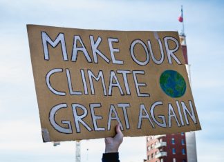 Olympians fight climate change but LA28 odds look grim Turin (Torino), Piedmont, Italy - March 15th 2019: make our climate great again sign during fridays for future strike.