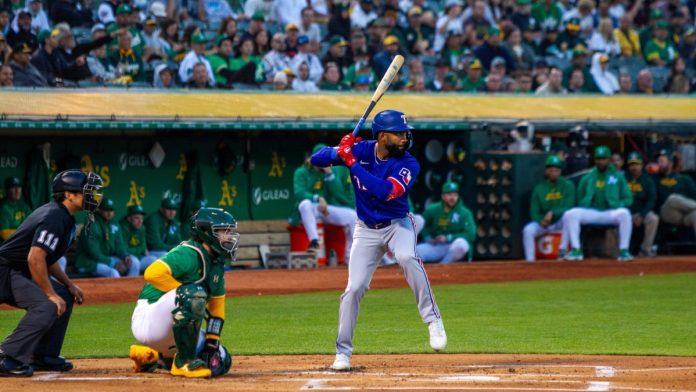 Texas-Rangers Oakland, California - September 25, 2024: Texas Rangers outfielder Sandro Fabian bats against the Oakland Athletics in the last night game at the Oakland Coliseum.