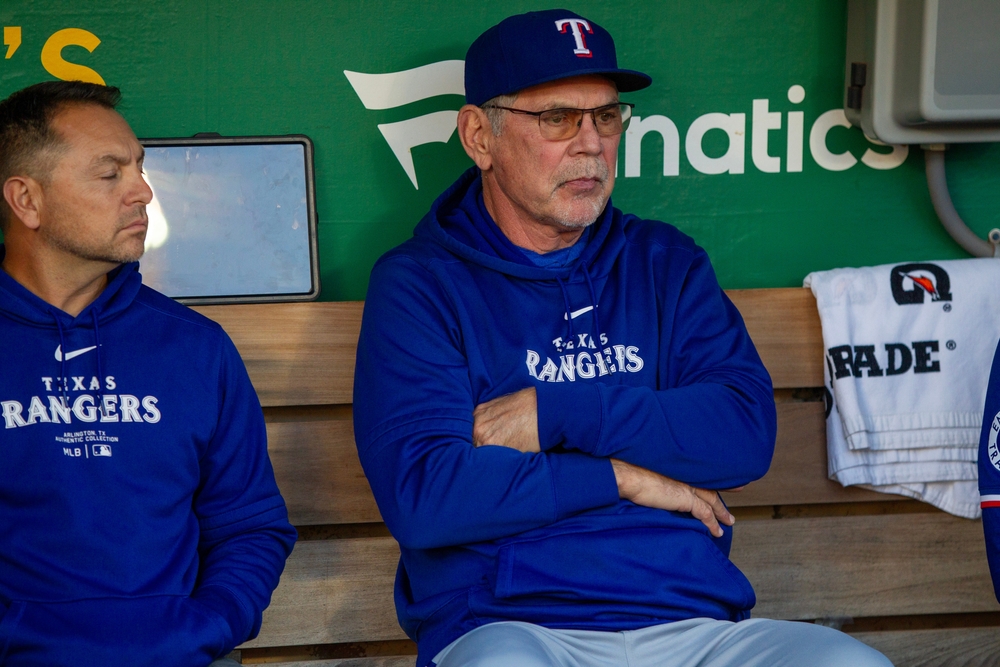 Oakland, California - September 25, 2024: Texas Rangers manager Bruce Bochy in the dugout before the last night game at the Oakland Coliseum against the Oakland Athletics.
