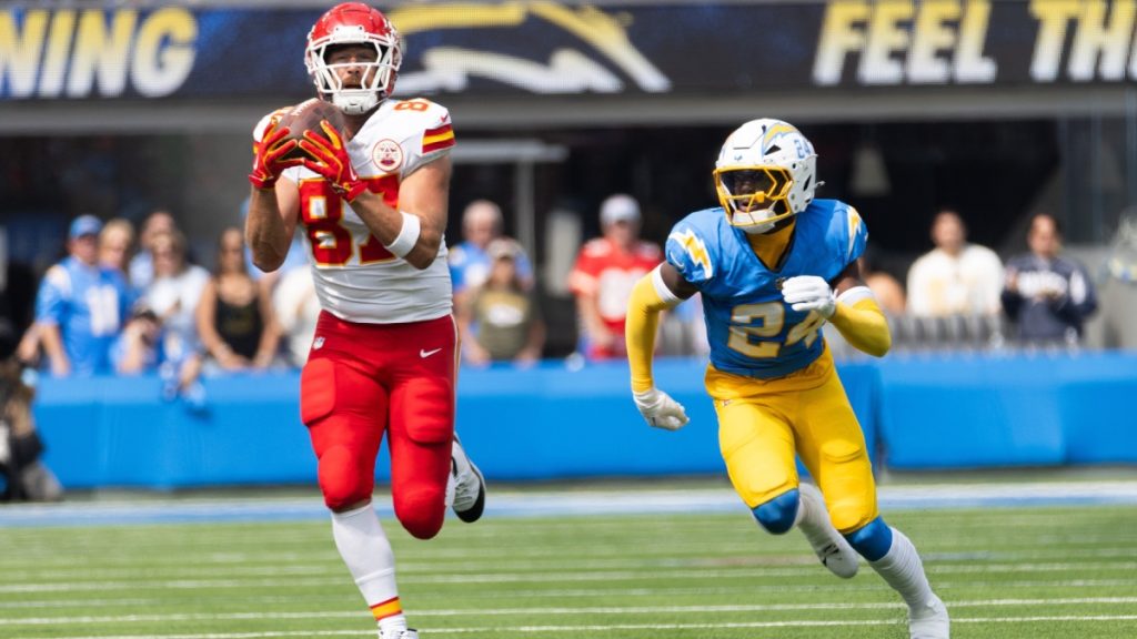 KC Chiefs tie end Travis Kelce #87 catches a pass next to LA Chargers safety AJ Finley #24 during an NFL football game at SoFi Stadium, Aug. 17, 2024, in Inglewood, Calif.

