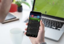 IBIA flags 70 suspicious betting alerts in Q1 Guy focused on betting odds on his smartphone. Follows a football game on his laptop