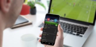 IBIA flags 70 suspicious betting alerts in Q1 Guy focused on betting odds on his smartphone. Follows a football game on his laptop