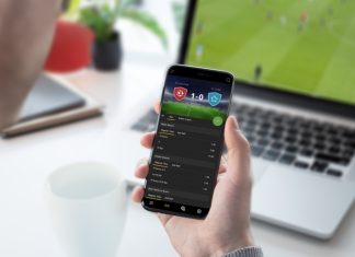 IBIA flags 70 suspicious betting alerts in Q1 Guy focused on betting odds on his smartphone. Follows a football game on his laptop