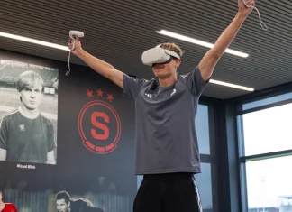 Why football should prioritise cognitive ROI over commercial Football player wearing a VR headset.