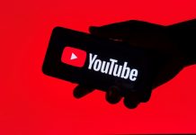 The Overlap goes all-in with The United Stand takeover Close up view of a hand holding a mobile phone with the YouTube application displayed.