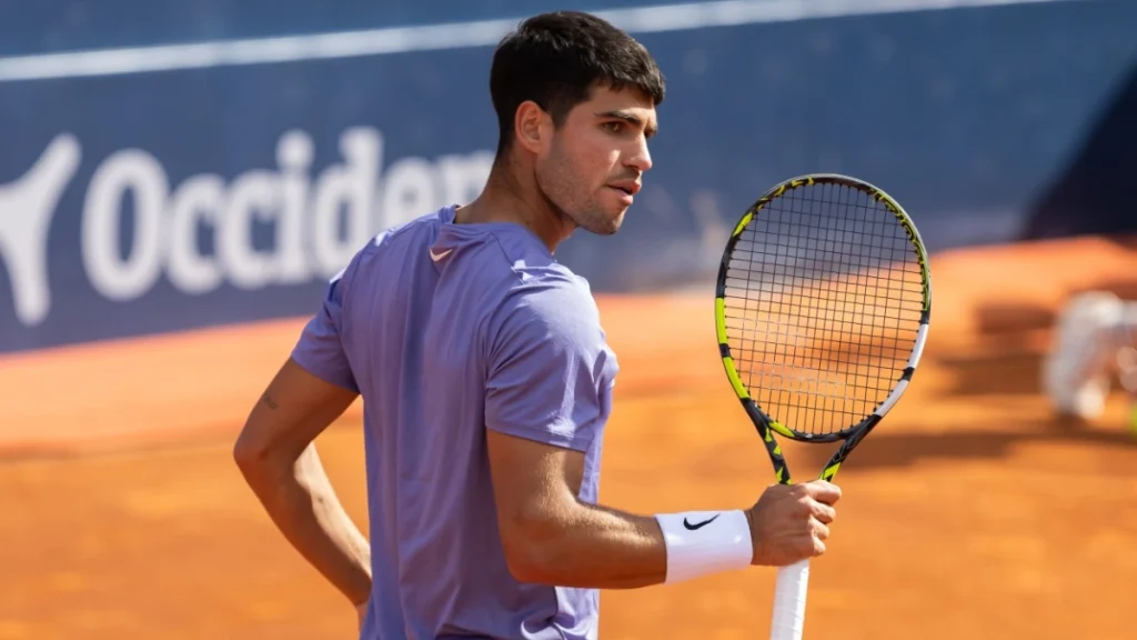 Professional tennis players. Tennis courts. Carlos Alcaraz on a dirt track.