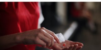 Do the Enhanced Games still work if the drugs don’t? Soccer player, hands and pills with vitamin supplement for sport, challenge or competition in locker room. Closeup, person or athlete with medication, antibiotic or prescription for game or match.