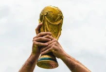 FIFA risks 22.6% World Cup reach loss amid India and China talks June 12, 2018, Doha, Qatar, A man holds the FIFA World Cup in his hands.