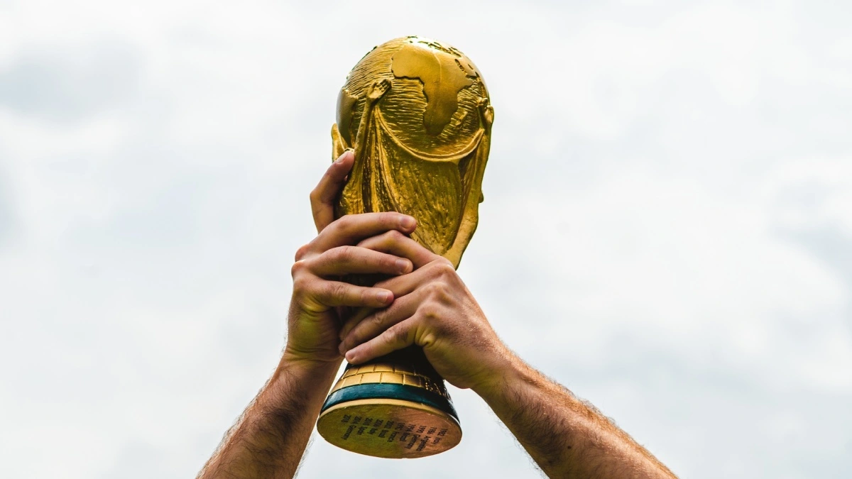 June 12, 2018, Doha, Qatar, A man holds the FIFA World Cup in his hands.