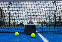 Q&A: Can padel ever become a ‘serious’ professional sport? Padel racket on a padel blue court with a ball.