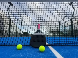 Q&A: Can padel ever become a ‘serious’ professional sport? Padel racket on a padel blue court with a ball.