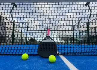 Q&A: Can padel ever become a ‘serious’ professional sport? Padel racket on a padel blue court with a ball.