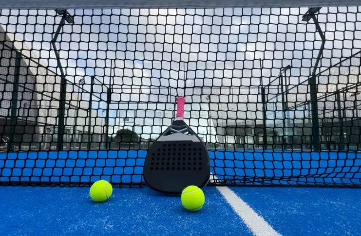 Q&A: Can padel ever become a ‘serious’ professional sport? Padel racket on a padel blue court with a ball.