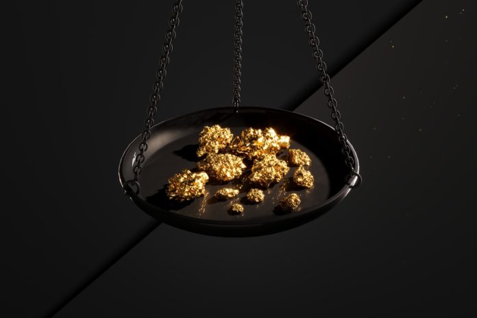 Close up of a jewellery scale with gold nuggets.