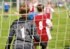 UK government plans to strip Sport England of planning powers Youth football goalkeeper in a grassroots match.