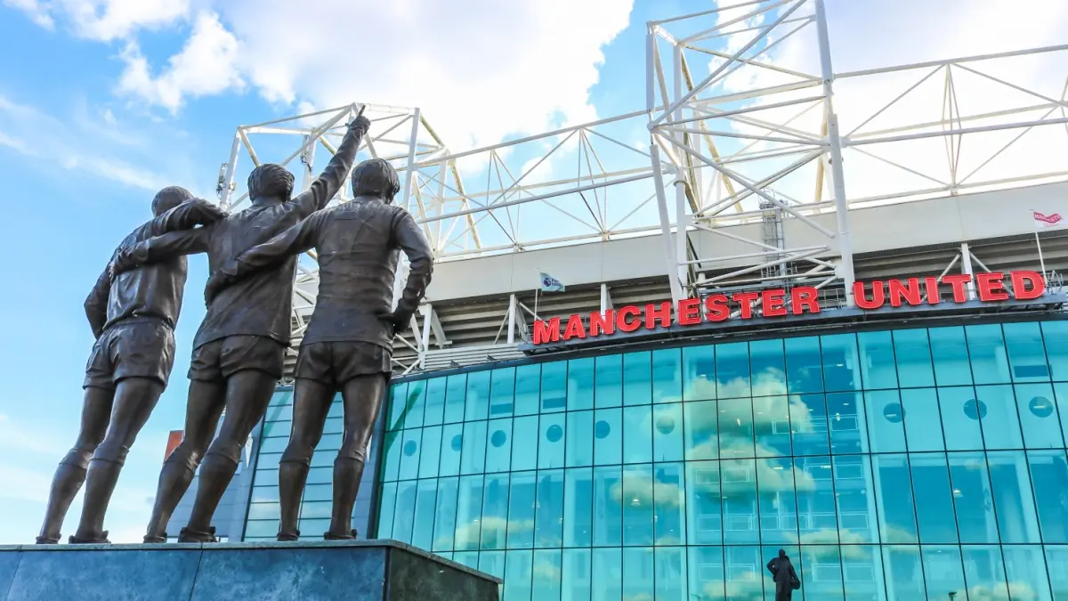 The United Trinity refers to the Manchester United trio of George Best, Denis Law, and Sir Bobby Charlton at Old Trafford stadium