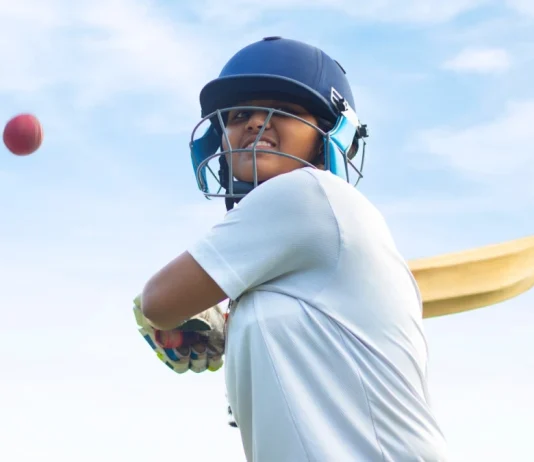 Five new cricket domes funded ahead of Women’s T20 World Cup Female Indian cricket player wearing protective gear and hitting the ball with a bat on the field