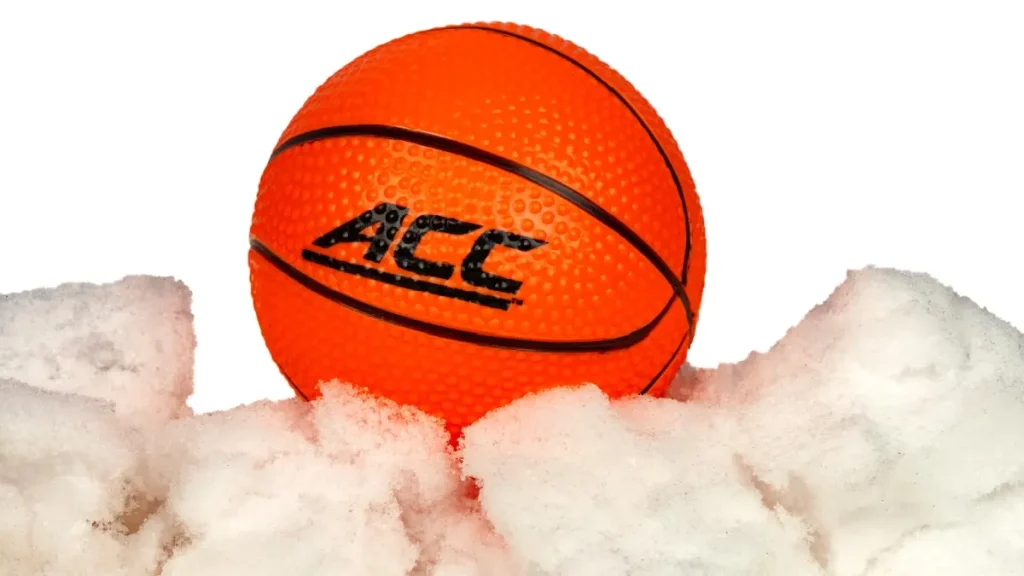 Orange basketball with ACC printed on it in ice and snow.