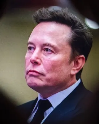 Elon musk is seen through a hole while testifying before the senate judiciary committee on artificial intelligence in washington, dc, New York City, October 06, 2025.