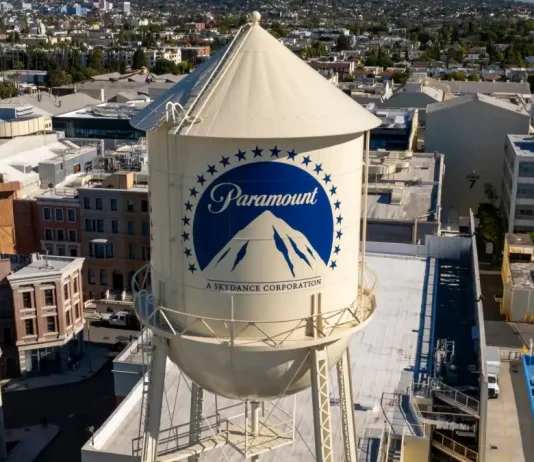 Paramount-Warner Bros merger halted for court review Los Angeles California. USA: 2025 December 9. Motion picture industry studio. Paramount Pictures, The Studios at Paramount Pictures. Aerial, water tank and tower logo.