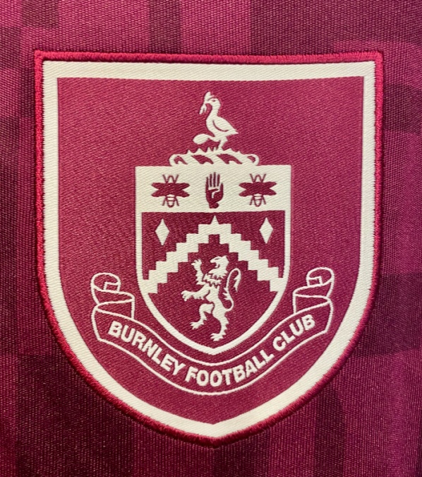 A close up view of a Burnley Football Club badge, on a young man's football shirt, in a large retail sports shop, in Fleetwood, Lancashire, United Kingdom, Europe on Friday 27th, February, 2026. 