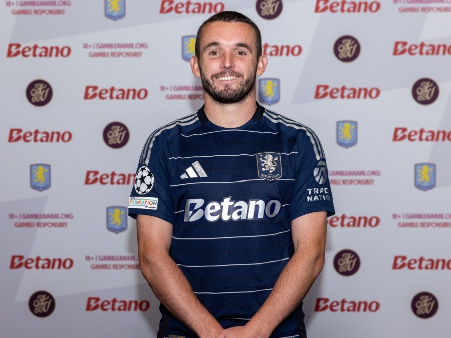 John McGinn posing in Aston Villa's third kit.
