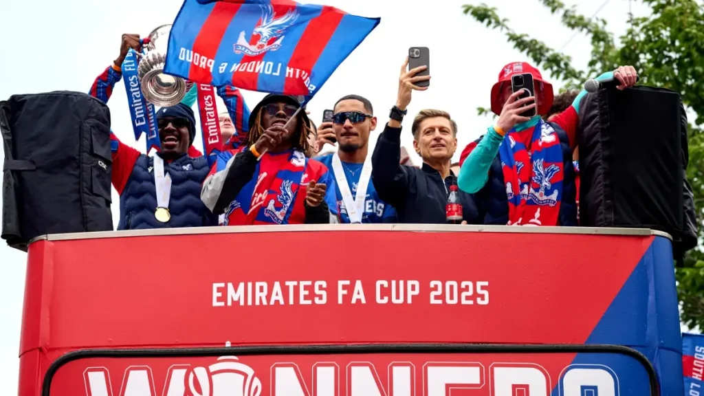 Crystal Palace players celebrate on an open top bus during the FA Cup trophy parade