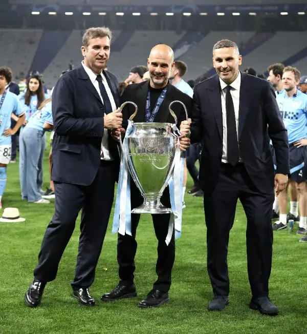 Ferran Soriano poses with Pep Guardiola and Khaldoon Al Mubarak during UEFA Champions League final.