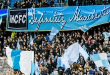 Manchester City found guilty over £900m ‘sham’ deals UNITED KINGDOM, MANCHESTER - November 21th 2017: Fans and supporters with mcfc definitely manchester banner During the Champions League match Manchester City - Feyenoord at the Etihad Stadium
