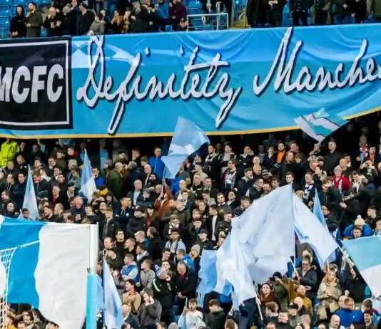 Manchester City found guilty over £900m ‘sham’ deals UNITED KINGDOM, MANCHESTER - November 21th 2017: Fans and supporters with mcfc definitely manchester banner During the Champions League match Manchester City - Feyenoord at the Etihad Stadium