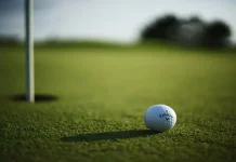 Good Good Golf “got it so wrong”, says crisis expert KANSAS CITY, UNITED STATES - Oct 11, 2021: A selective focus shot of a Callaway Golf ball near hole pin on a grass golf field.