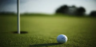 Good Good Golf “got it so wrong”, says crisis expert KANSAS CITY, UNITED STATES - Oct 11, 2021: A selective focus shot of a Callaway Golf ball near hole pin on a grass golf field.