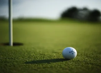 Good Good Golf “got it so wrong”, says crisis expert KANSAS CITY, UNITED STATES - Oct 11, 2021: A selective focus shot of a Callaway Golf ball near hole pin on a grass golf field.