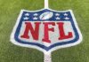 Goodell hints NFL could exit rights deals early Inglewood, CA, USA - November 14, 2024: An NFL logo on a green artificial grass football field line in full color.