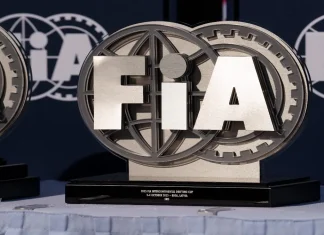 Ukraine urges FIA to act on Russian offices in Crimea Latvia, Riga 03-05.10.2025. FIA Drifting cup, two trophies sitting on top of a table covered with a white cloth In the background, there is a banner with the words FIA written on it.